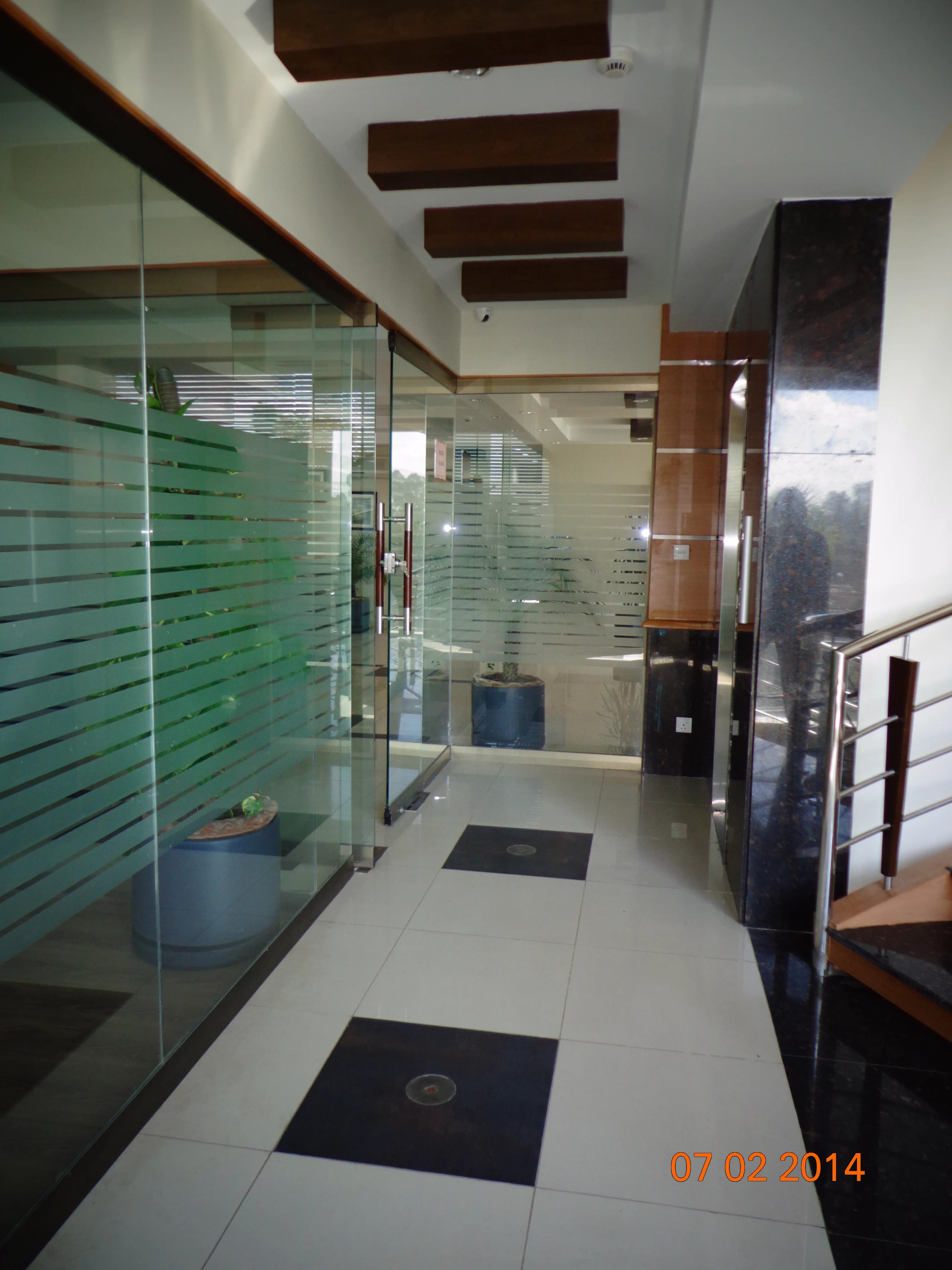Commercial interior with glazed partitions and stair