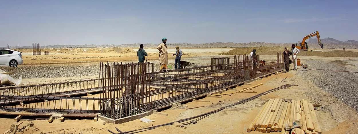 Construction site in a broad desert landscape
